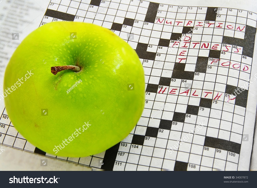 stock-photo-closeup-of-a-fresh-green-apple-and-crossword-puzzle-34007872