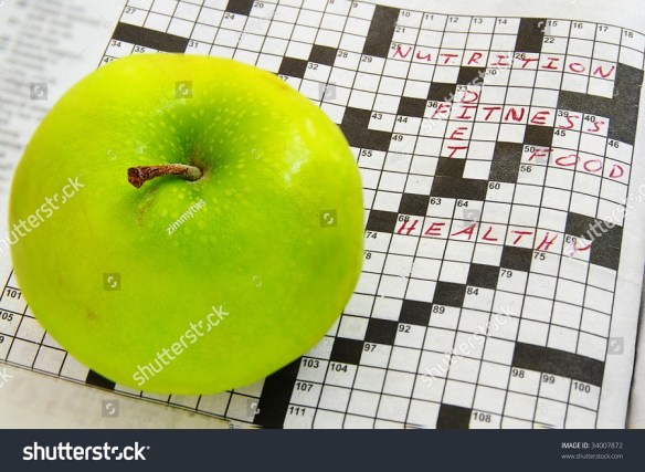 stock-photo-closeup-of-a-fresh-green-apple-and-crossword-puzzle-34007872